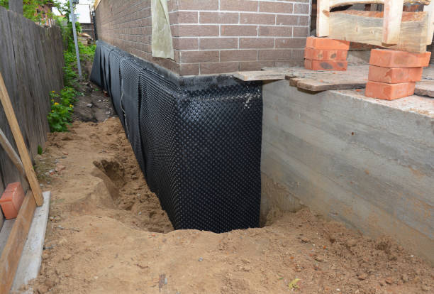 Happy homeowners after waterproofing job in Strykersville